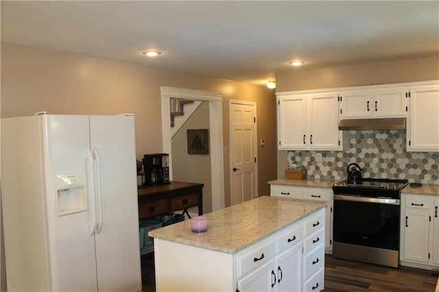 1658 NW 785th Rd, Bates City, MO 64011 - kitchen featuring white refrigerator with ice dispenser, stainless steel electric stove, dark wood-style flooring, white cabinets, and under cabinet range hood
