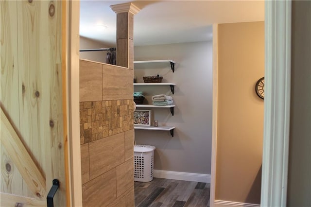 1658 NW 785th Rd, Bates City, MO 64011 - bathroom with wood finished floors, baseboards, and ornate columns