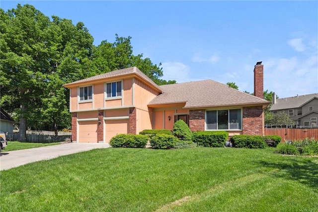 tri-level home with brick siding, concrete driveway, a chimney, a garage, and a shingled roof