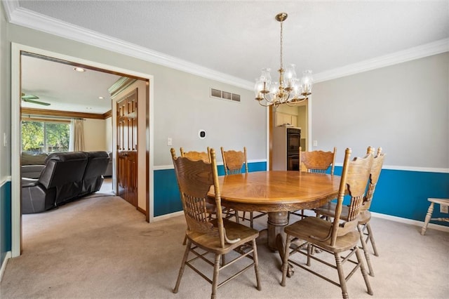 dining area featuring ornamental molding, a chandelier, light carpet, and baseboards