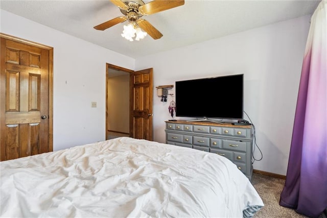 carpeted bedroom with a ceiling fan
