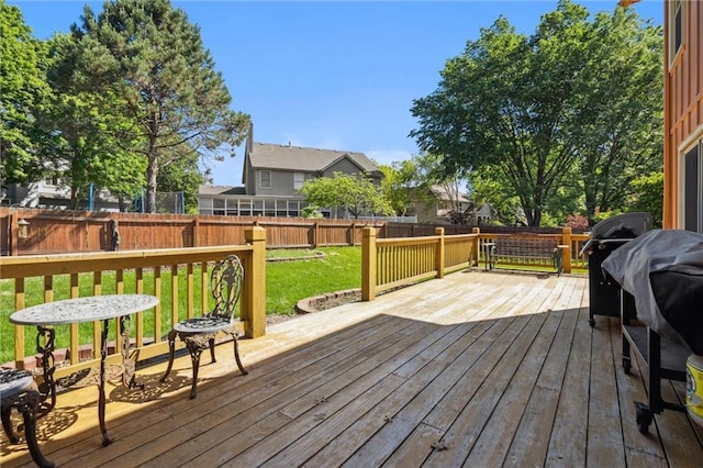 wooden terrace with area for grilling