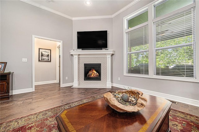 4310 N 141st Pl, Basehor, KS 66007 - living room featuring wood finished floors, a fireplace, crown molding, and baseboards