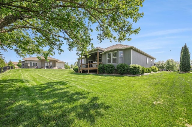 4310 N 141st Pl, Basehor, KS 66007 - back of property with a yard and a deck