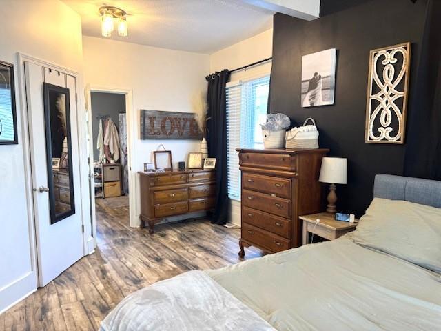 bedroom with wood finished floors