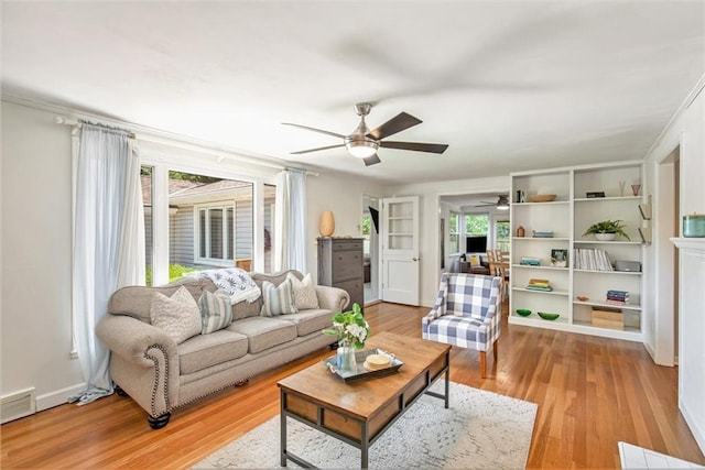 7408 Ash St, Prairie Village, KS 66208 - living room featuring ceiling fan, plenty of natural light, and light wood-style floors
