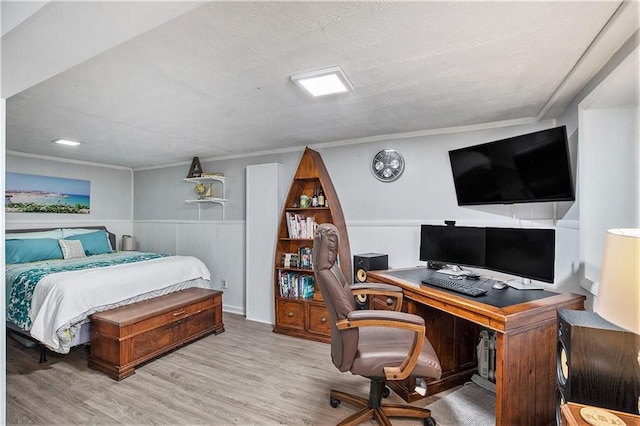 7408 Ash St, Prairie Village, KS 66208 - bedroom featuring wood finished floors, an office area, a wainscoted wall, and ornamental molding
