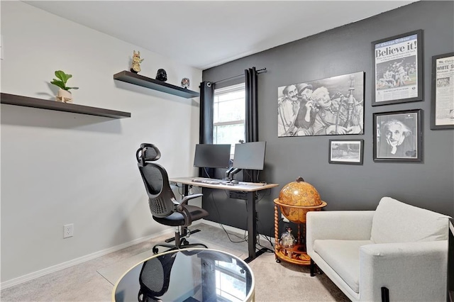 carpeted office space featuring baseboards