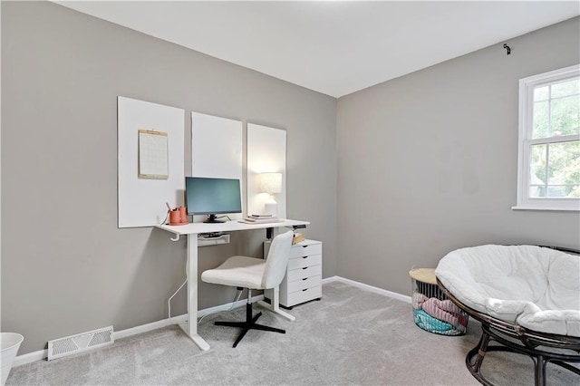 home office with light colored carpet and baseboards