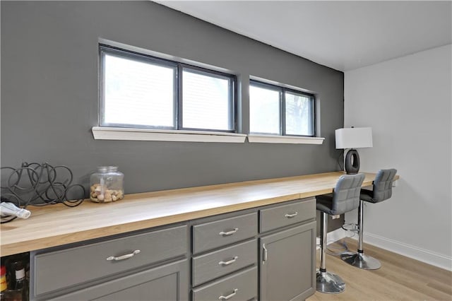 office featuring light wood-style flooring and baseboards