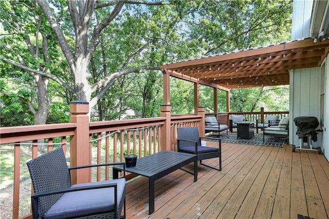 wooden terrace featuring an outdoor living space and a grill