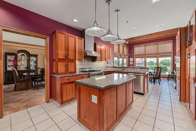 kitchen with dishwasher, wall chimney range hood, a kitchen island, a peninsula, and brown cabinetry