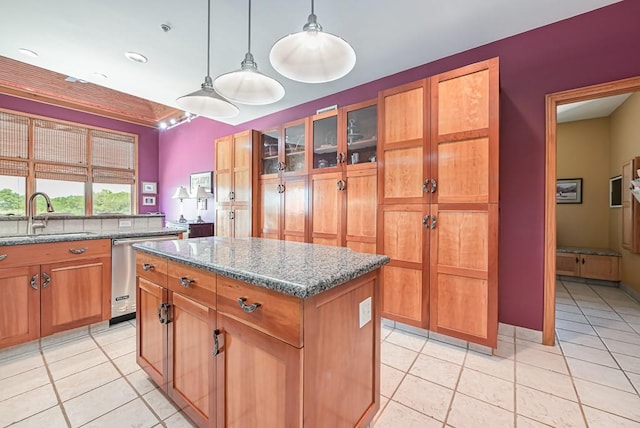 kitchen featuring a sink, dishwasher, light tile patterned floors, a kitchen island, and recessed lighting