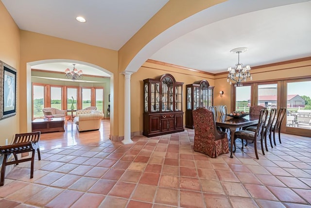 dining room with a chandelier, arched walkways, ornate columns, recessed lighting, and baseboards
