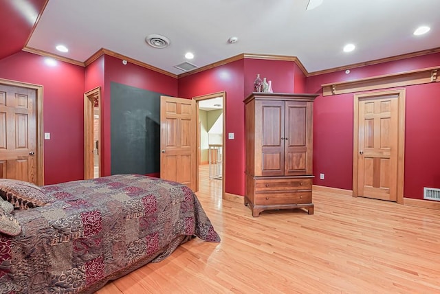 bedroom with light wood finished floors, crown molding, baseboards, and recessed lighting