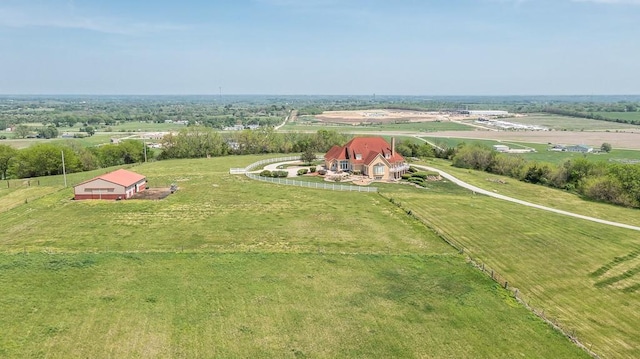 aerial view of sparsely populated area featuring a pastoral area