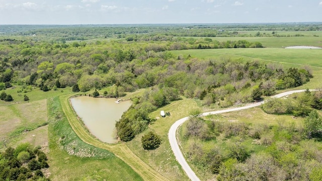 aerial view of property and surrounding area with a large body of water