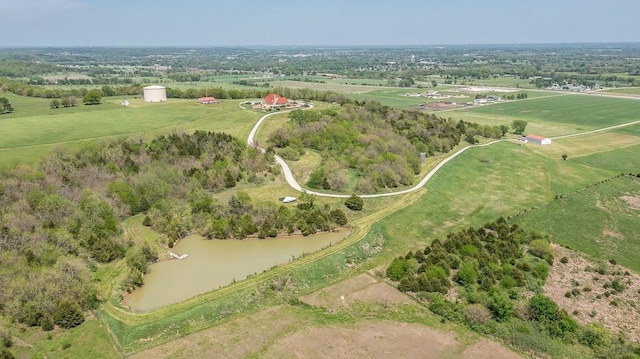aerial view of property and surrounding area featuring rural landscape
