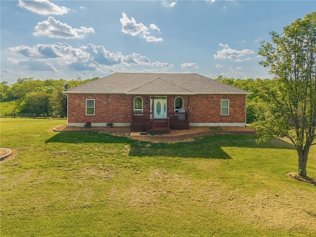 23780 Moberly Rd, Polo, MO 64671 - view of front of home with brick siding, a front lawn, and roof with shingles