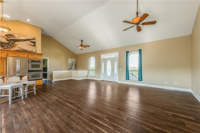 23780 Moberly Rd, Polo, MO 64671 - living room with ceiling fan, dark wood finished floors, baseboards, and high vaulted ceiling