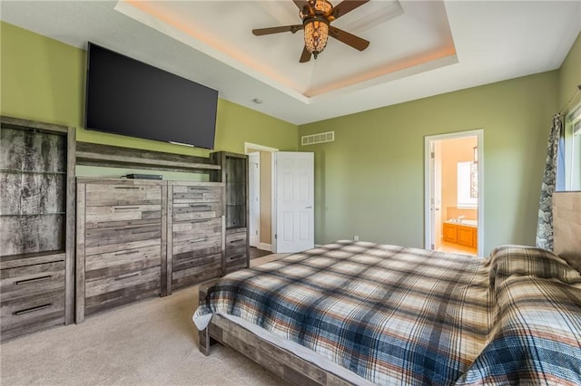 23780 Moberly Rd, Polo, MO 64671 - bedroom with a raised ceiling, carpet flooring, connected bathroom, and ceiling fan