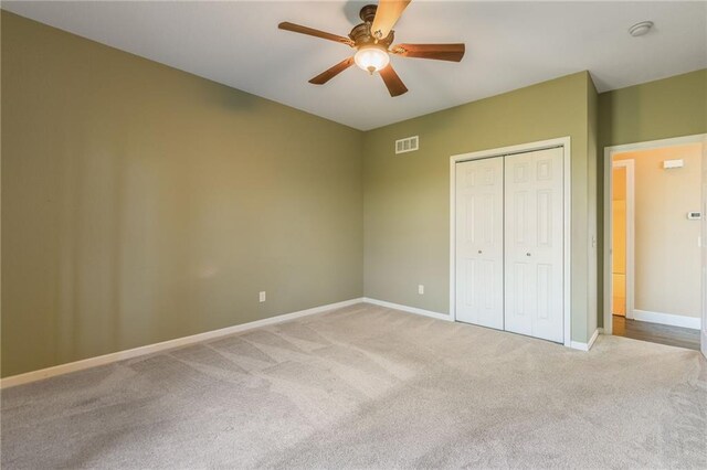 23780 Moberly Rd, Polo, MO 64671 - unfurnished bedroom featuring carpet floors, a closet, baseboards, and ceiling fan