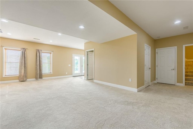 23780 Moberly Rd, Polo, MO 64671 - empty room with light colored carpet, baseboards, recessed lighting, and stairs