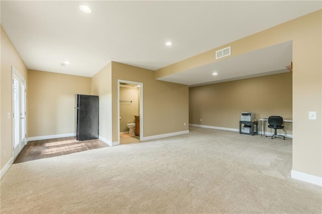 23780 Moberly Rd, Polo, MO 64671 - unfurnished living room featuring light carpet, baseboards, recessed lighting, and an office area