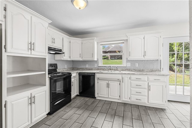 11719 E 30th Ter S, Independence, MO 64052 - kitchen with black appliances, a sink, under cabinet range hood, tasteful backsplash, and white cabinets