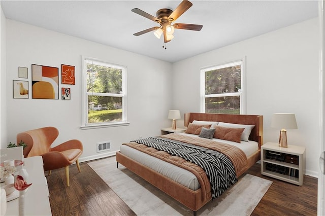 11719 E 30th Ter S, Independence, MO 64052 - bedroom featuring wood finished floors, baseboards, and ceiling fan