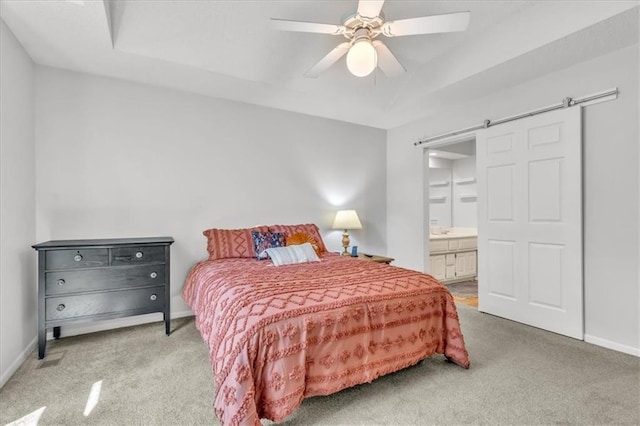 11065 W 98th St, Overland Park, KS 66214 - carpeted bedroom featuring a barn door, ensuite bathroom, and a ceiling fan