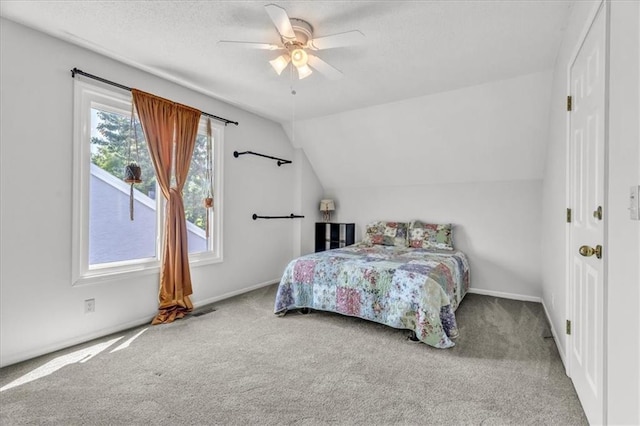 11065 W 98th St, Overland Park, KS 66214 - bedroom with carpet flooring, vaulted ceiling, ceiling fan, and a textured ceiling