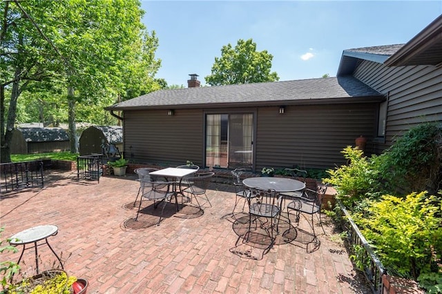 view of patio / terrace featuring outdoor dining space and fence