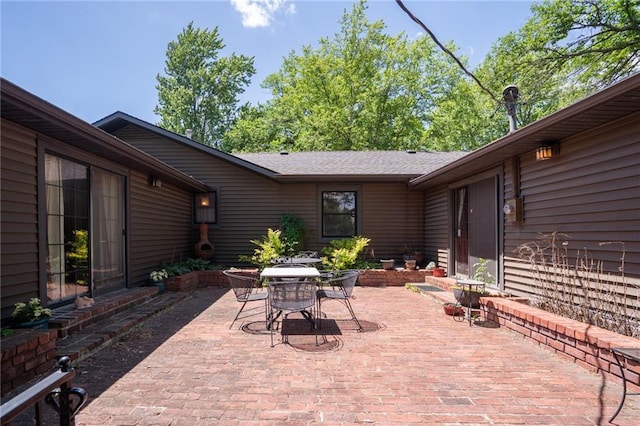 view of patio featuring outdoor dining area