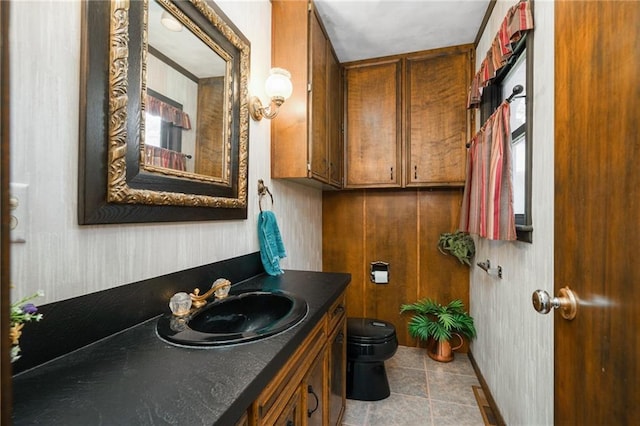 half bath featuring toilet and vanity
