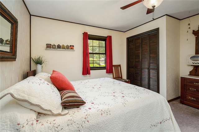 bedroom featuring carpet flooring, a closet, and ceiling fan
