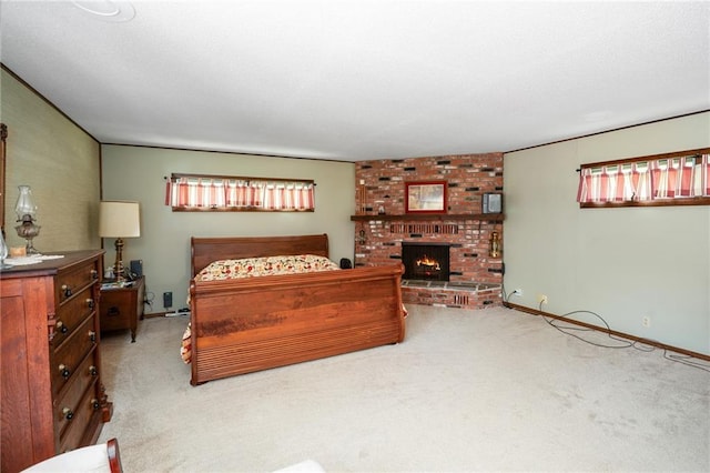 bedroom with carpet flooring and a fireplace