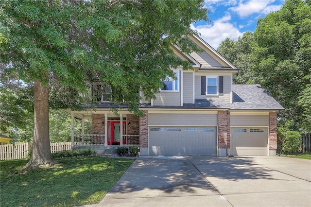 1906 Blackbird Cir, Kearney, MO 64060 - view of front of home featuring driveway, brick siding, a porch, and an attached garage