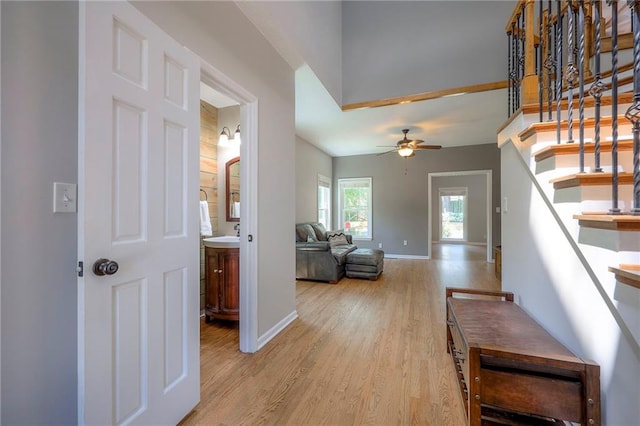 1906 Blackbird Cir, Kearney, MO 64060 - corridor featuring light wood finished floors and stairway