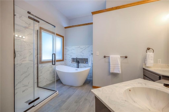 1906 Blackbird Cir, Kearney, MO 64060 - full bathroom featuring vanity, a marble finish shower, wood finished floors, a soaking tub, and tile walls