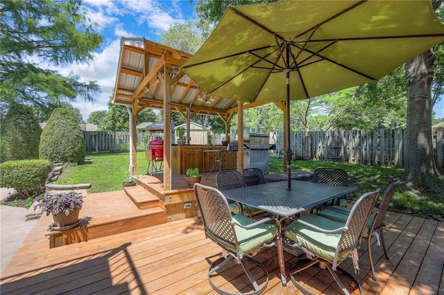 1906 Blackbird Cir, Kearney, MO 64060 - deck featuring a fenced backyard and outdoor dining area