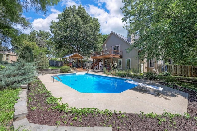 1906 Blackbird Cir, Kearney, MO 64060 - view of pool featuring stairs, a wooden deck, a patio area, a gazebo, and a diving board