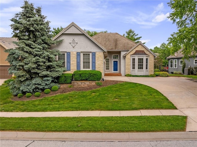 14393 S Cody St, Olathe, KS 66062 - view of front of home with a front lawn and stucco siding
