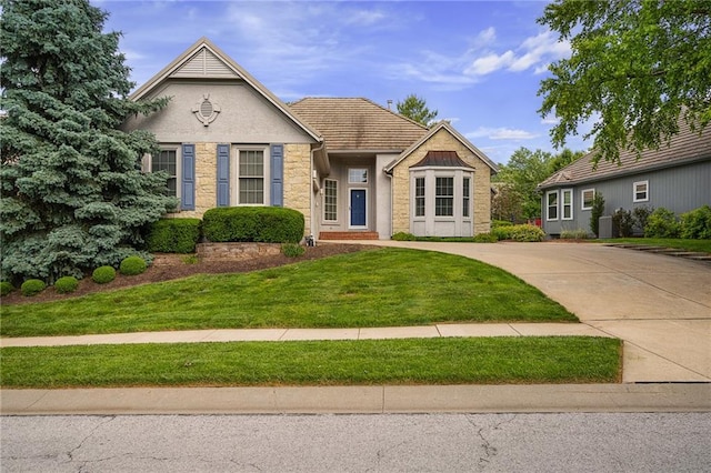 14393 S Cody St, Olathe, KS 66062 - view of front of property featuring stucco siding, a front lawn, and stone siding