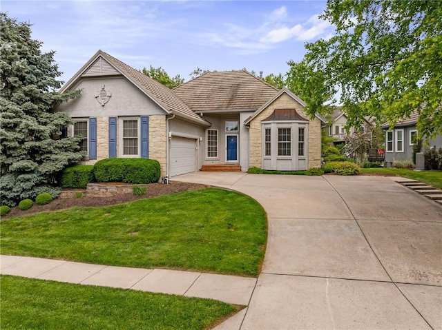 14393 S Cody St, Olathe, KS 66062 - view of front of home featuring an attached garage, a front yard, stucco siding, and concrete driveway
