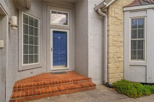 14393 S Cody St, Olathe, KS 66062 - view of exterior entry featuring stone siding and stucco siding