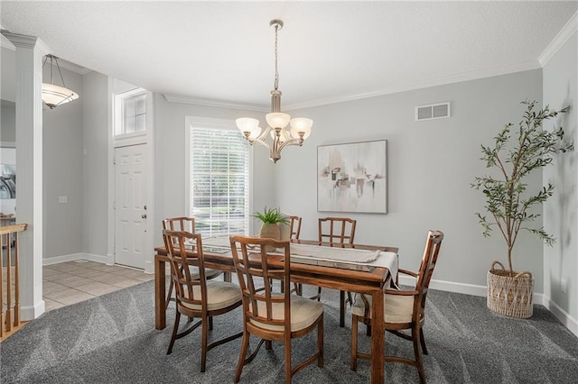 14393 S Cody St, Olathe, KS 66062 - dining area featuring crown molding, a chandelier, carpet, baseboards, and tile patterned flooring