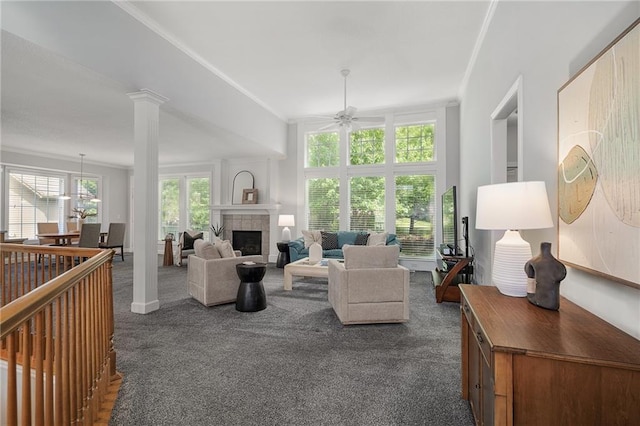 14393 S Cody St, Olathe, KS 66062 - living area with ceiling fan, dark carpet, a tile fireplace, and ornamental molding