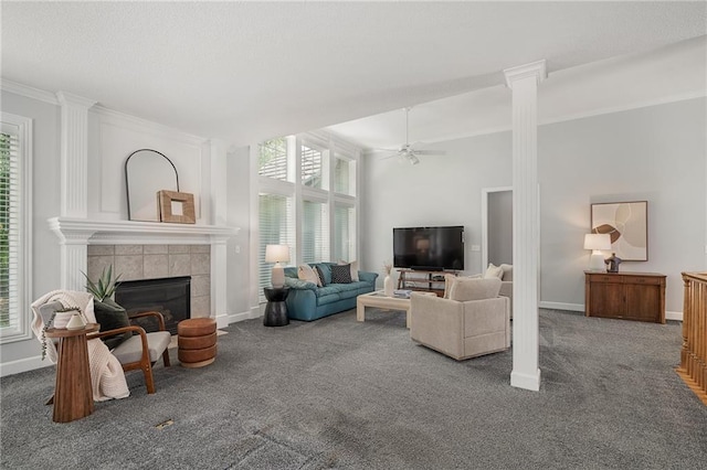 14393 S Cody St, Olathe, KS 66062 - living area featuring carpet floors, ceiling fan, a tile fireplace, crown molding, and baseboards