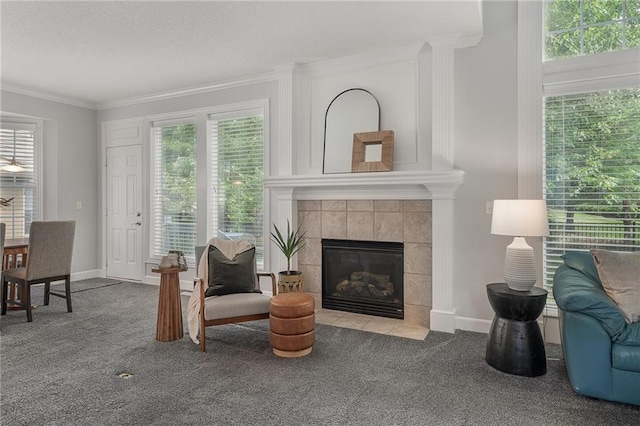 14393 S Cody St, Olathe, KS 66062 - carpeted living room featuring crown molding, a tile fireplace, and baseboards